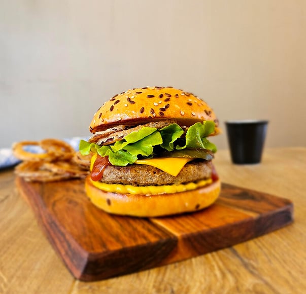 Gourmet Beef Burger with Tabasco Onion Rings and Pickles