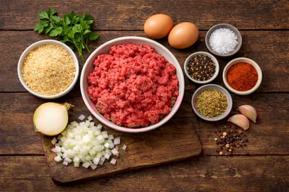 Burger ingredients on wooden table - ChatGPT Image