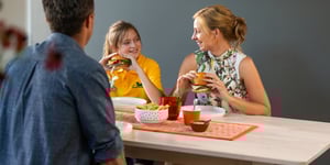 Family eating Angel Bay burgers