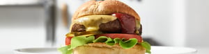 Burger with tomato and lettuce hero