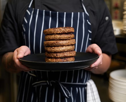 Patties stacked on a plate