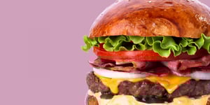 Tasty burger with lettuce, tomato, bacon, onion, cheese and Angel Bay beef burger patty.