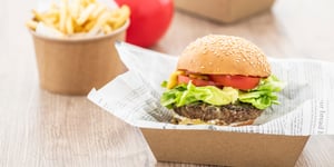 Takeaway beef burger with lettuce, tomato, and Angel Bay patty.