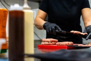 Raw patties being formed in kitchen